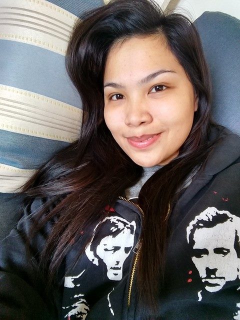 The satisfied look a woman has when she convinces her husband to buy a couch.